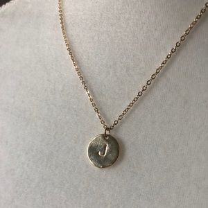 Gold colored J necklace